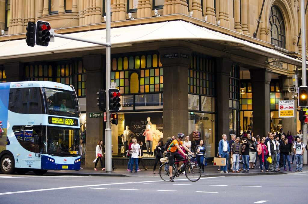 Visible Cyclist in busy city centre.