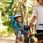 Child strapped in ebike child seat
