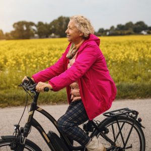 old woman on an electric bike